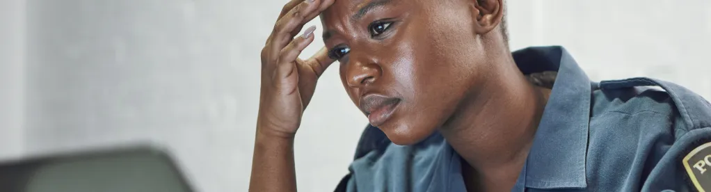 A close-up shot shows a person with a concerned expression resting their head against their hand.