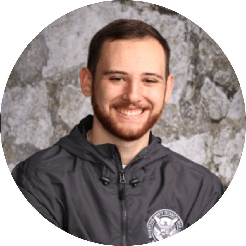 portrait of the student Kaleb Kalbflesh smiling